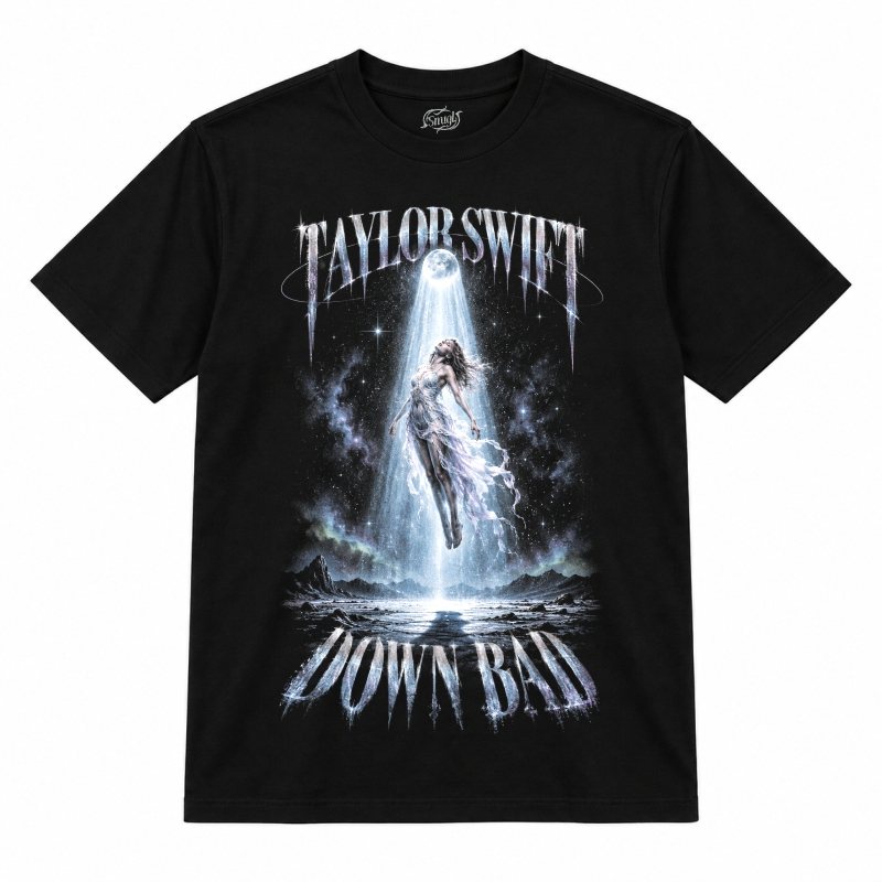 Camiseta preta Taylor Swift Down Bad com uma figura de vestido esvoaçante flutuando em um feixe de luz